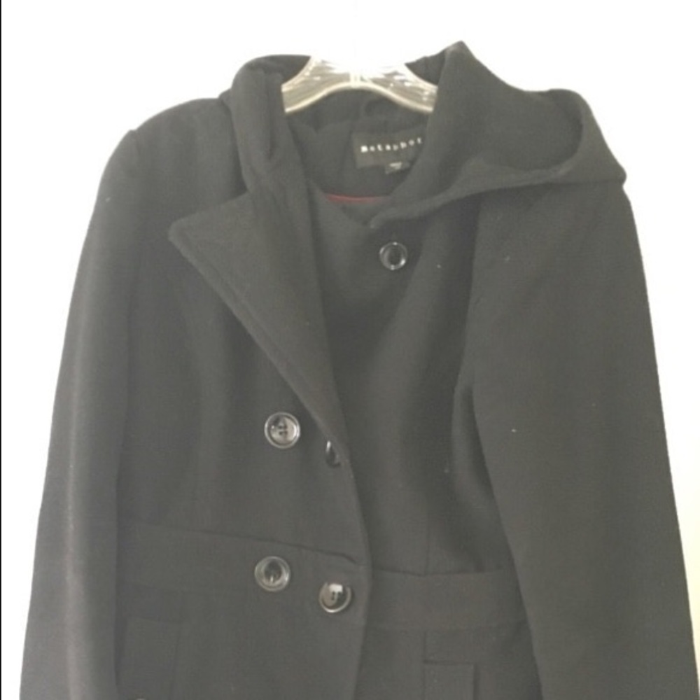 Black button up pea coat with a hood.